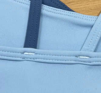 Bar-tack reinforcement detail on an activewear garment