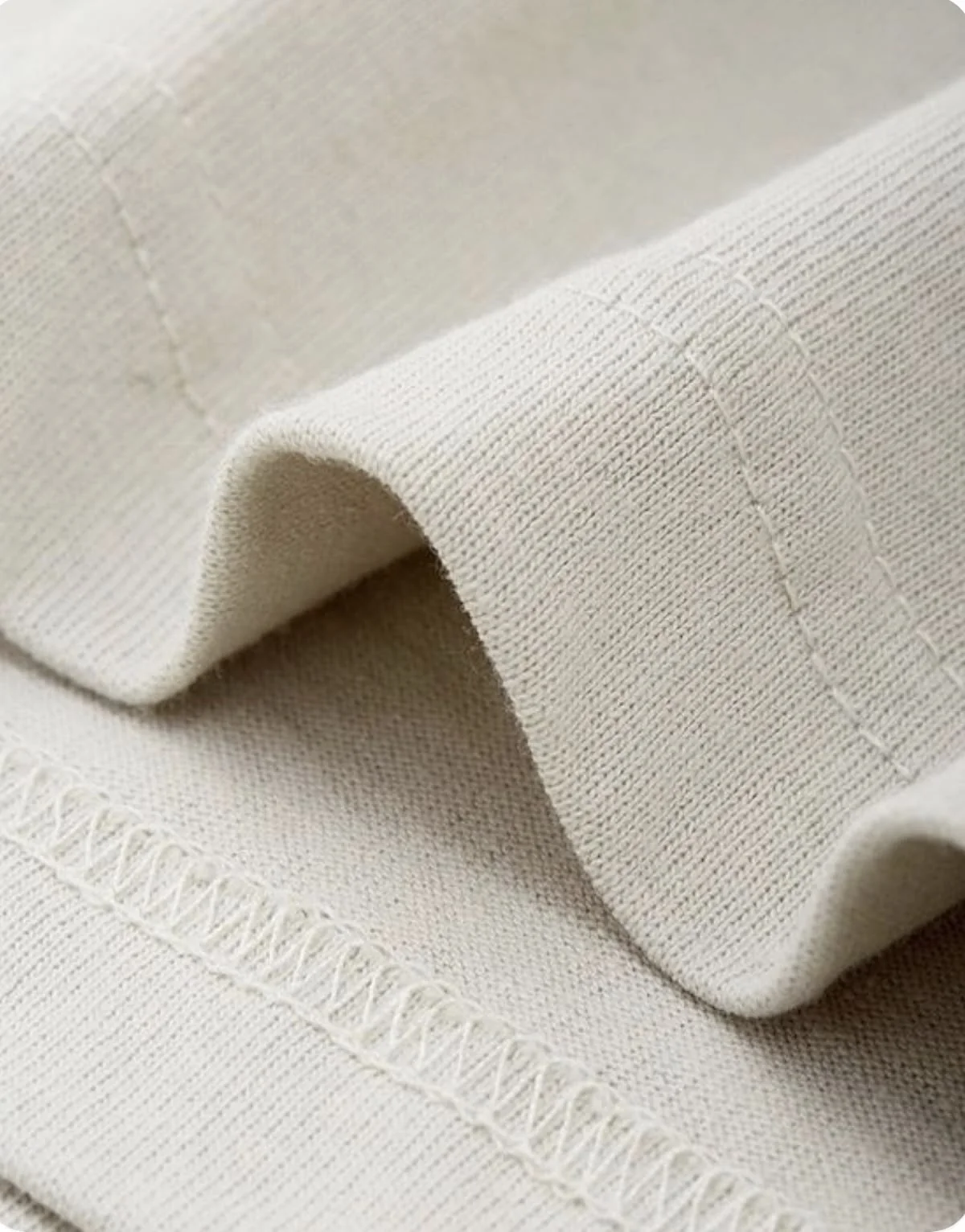 Cover-stitch finishing on stretch fabric