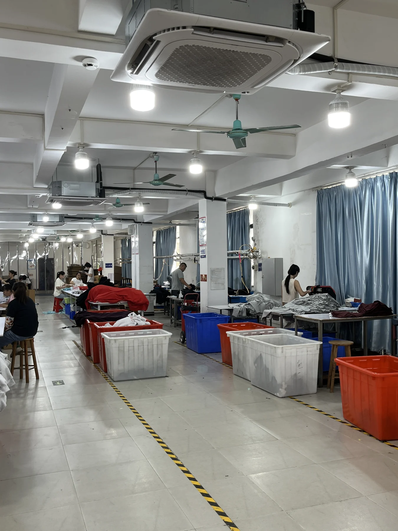 Final activewear workmanship and presentation check at MIQI