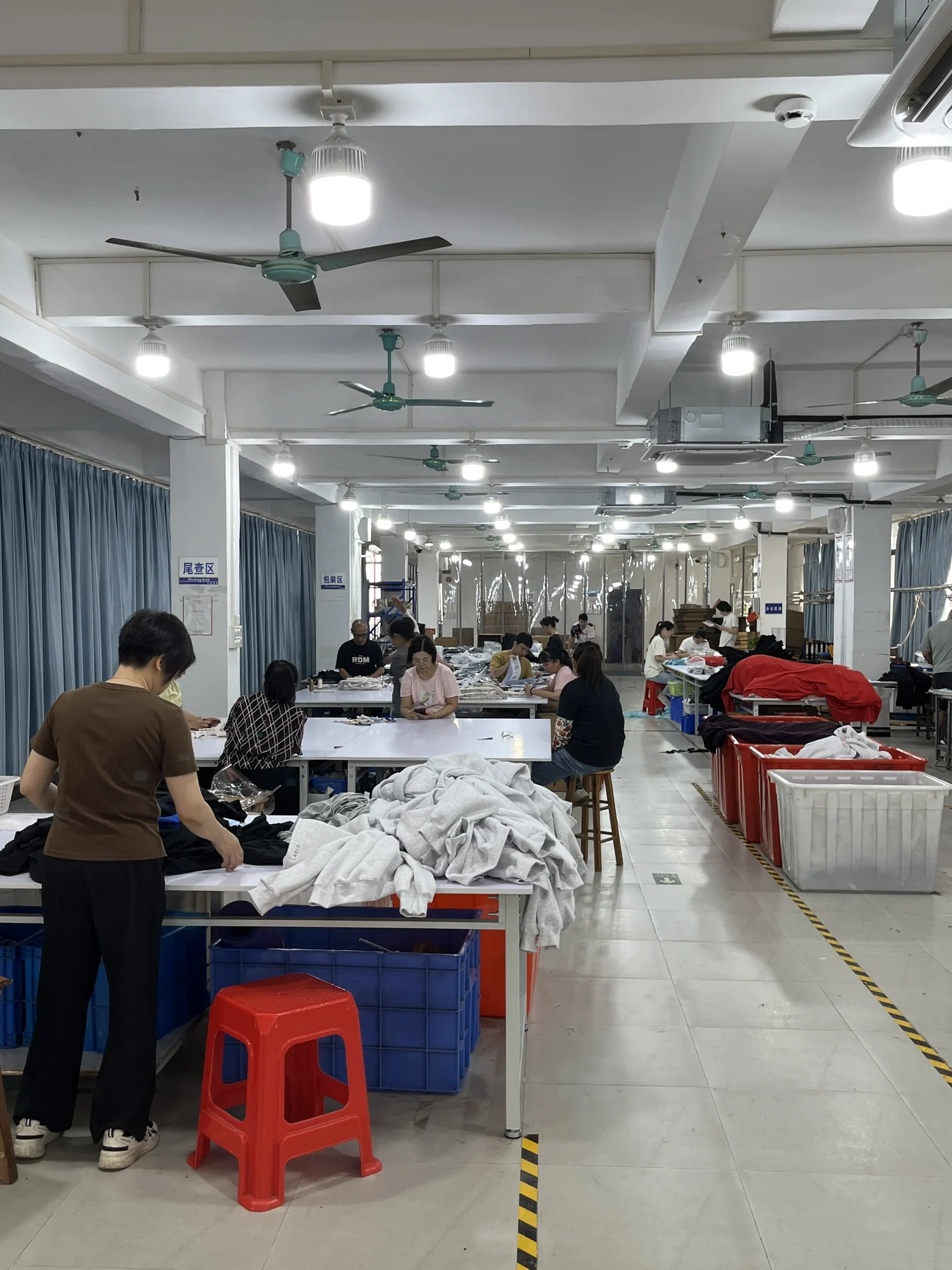 Finished activewear being reviewed during final inspection