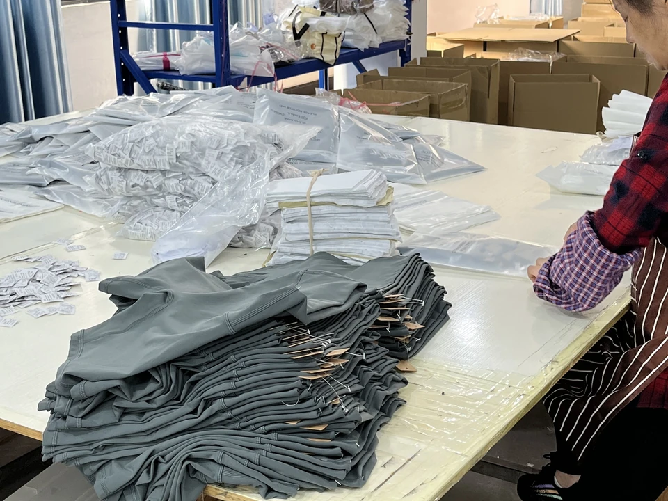 Finished activewear folded for individual garment packing