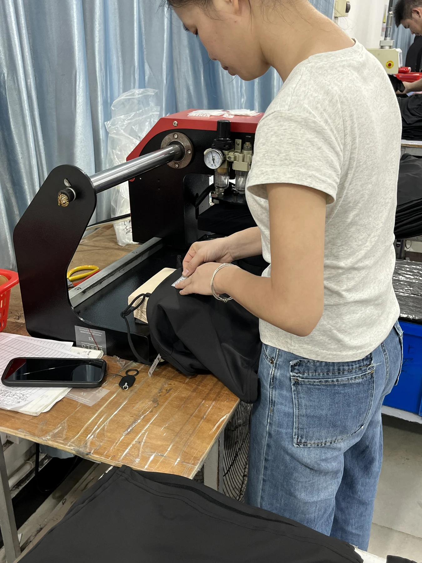 Heat press logo placement on an activewear garment at MIQI