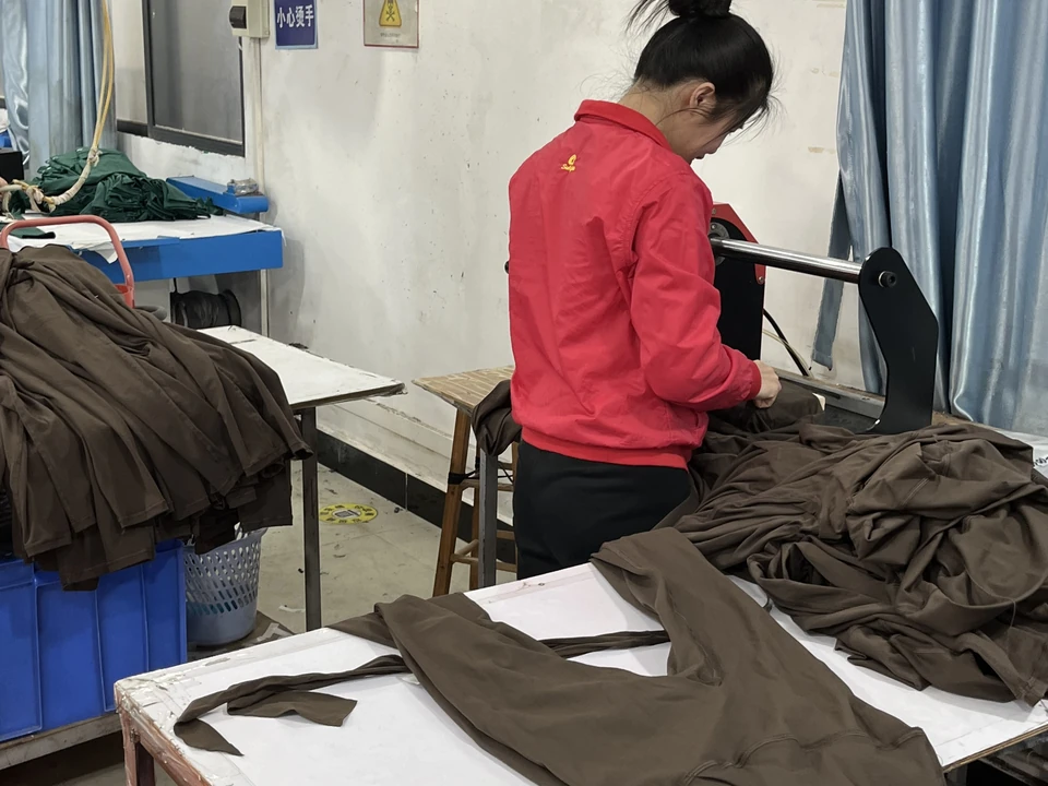 Logo heat transfer application on activewear garments