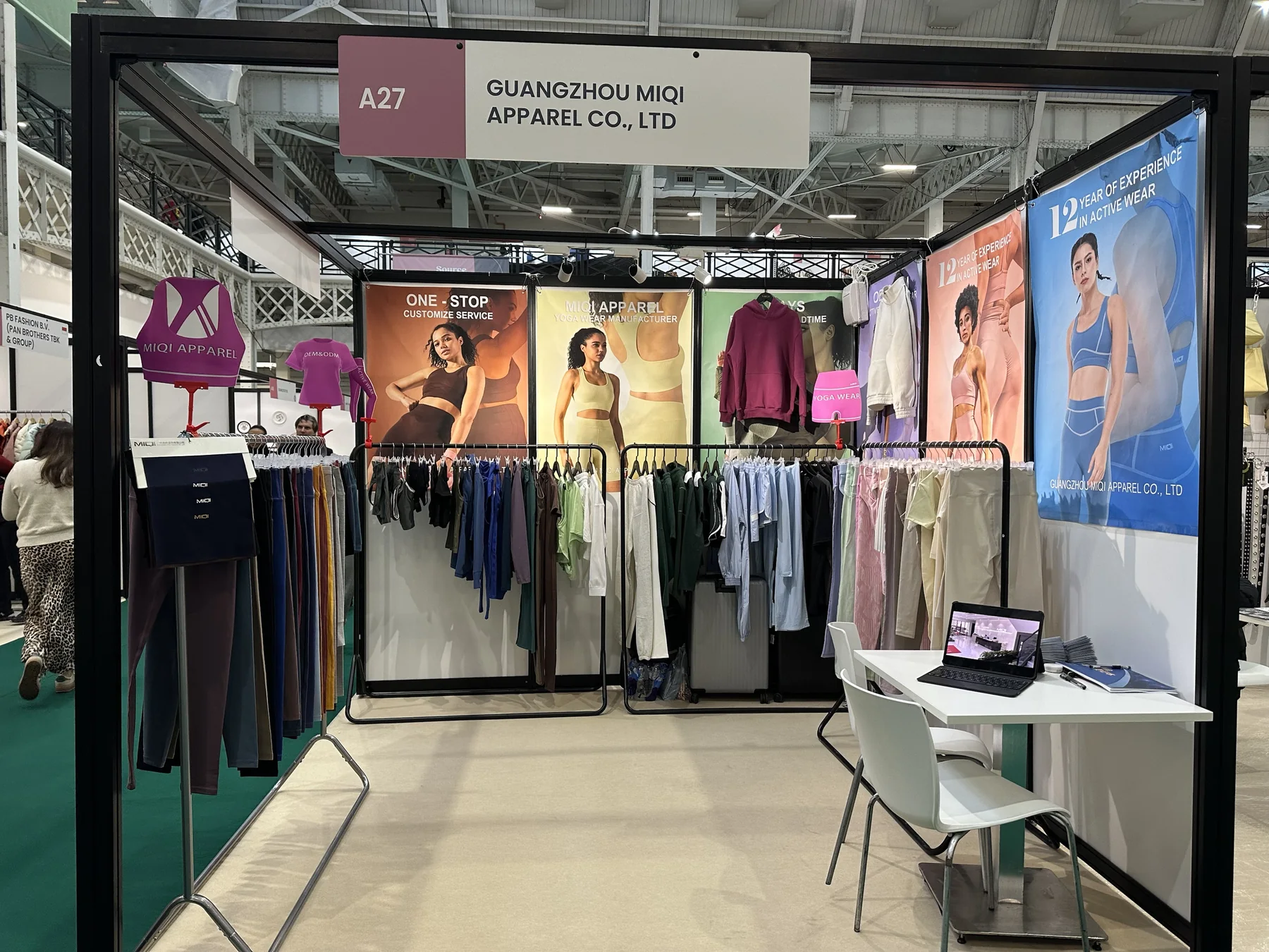 MIQI Apparel activewear booth at a United Kingdom trade show