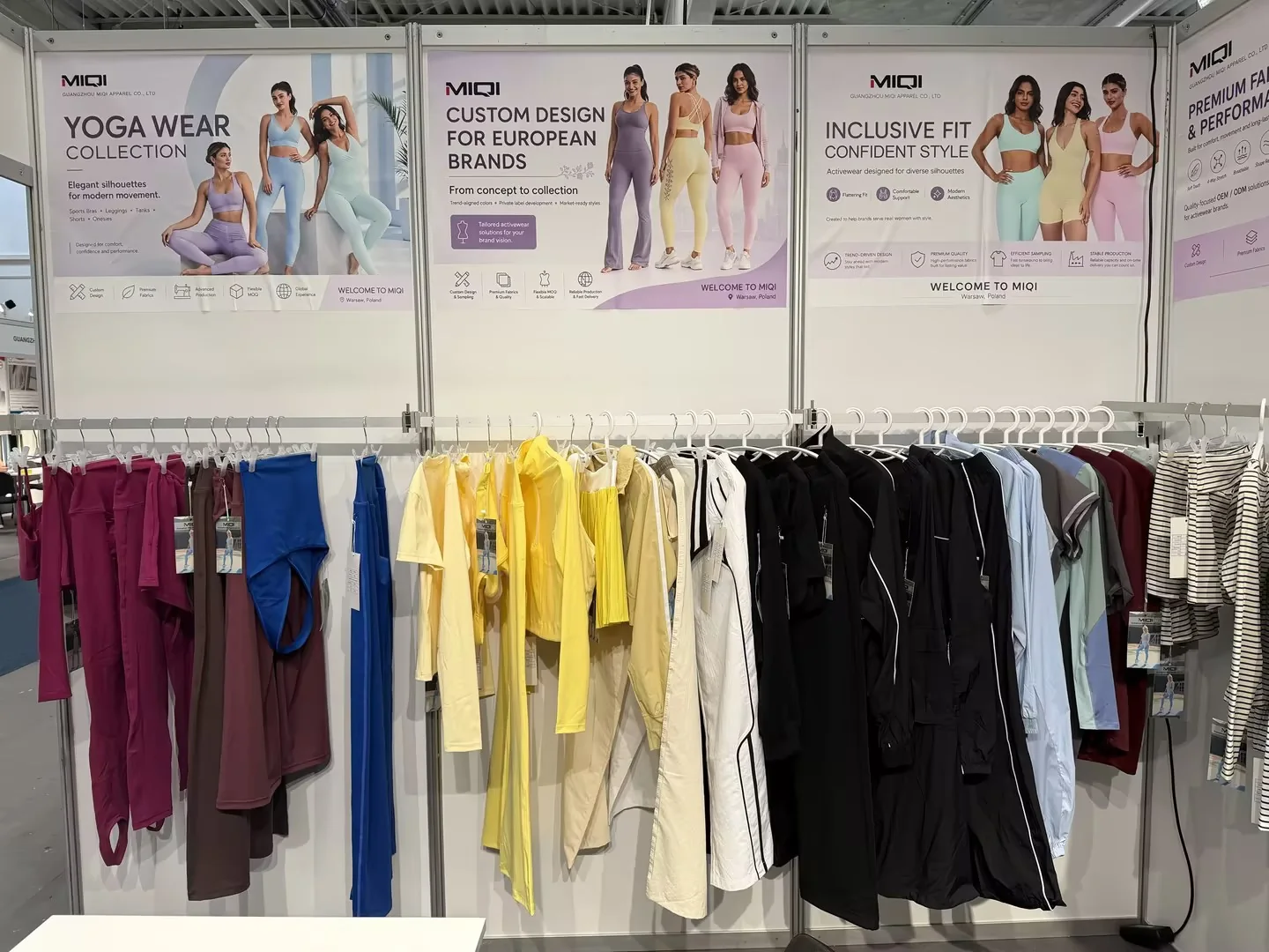 MIQI Apparel yoga wear collection displayed at a Poland trade show