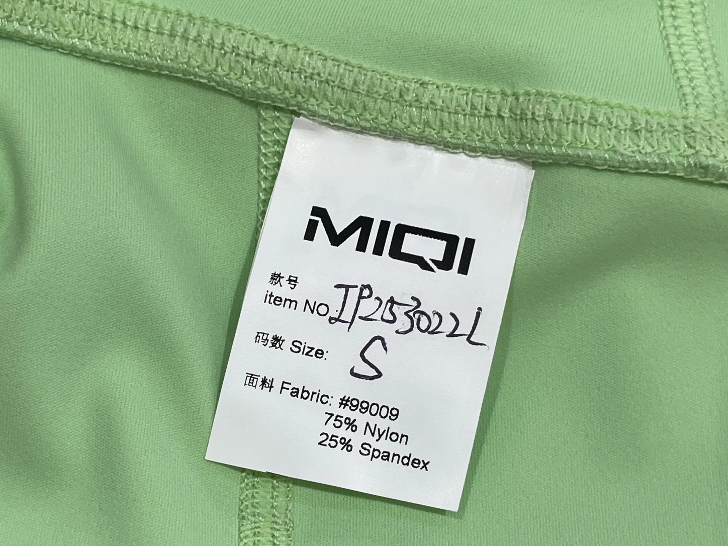 MIQI care label applied to a private-label activewear sample