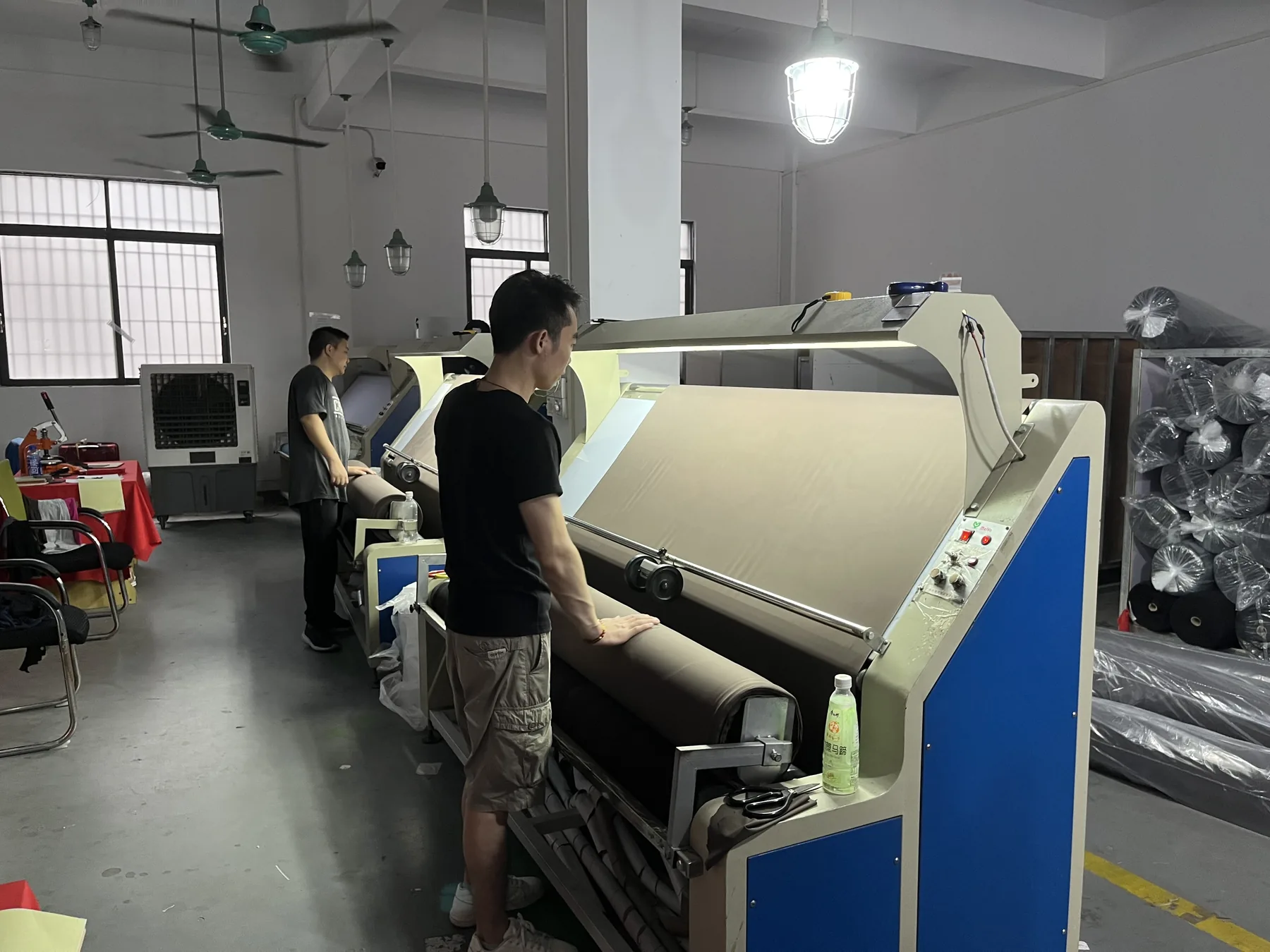 Fabric inspection machine used before activewear cutting and sewing