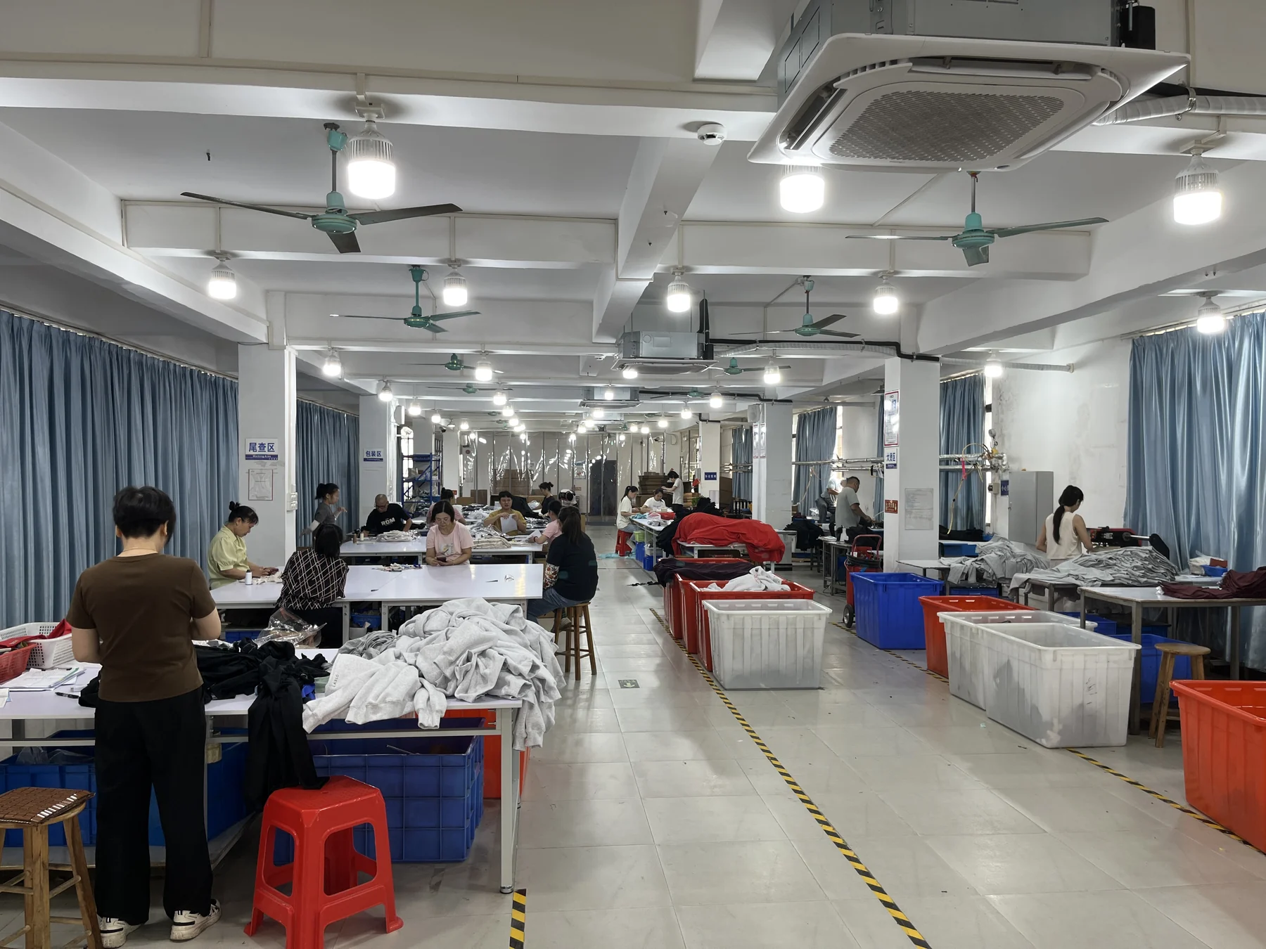 MIQI packing team preparing finished activewear orders