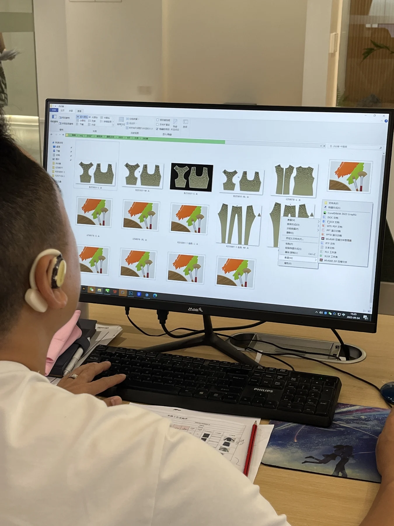 MIQI product developer reviewing activewear pattern and construction files