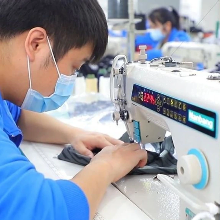 MIQI sewing technician developing an activewear sample