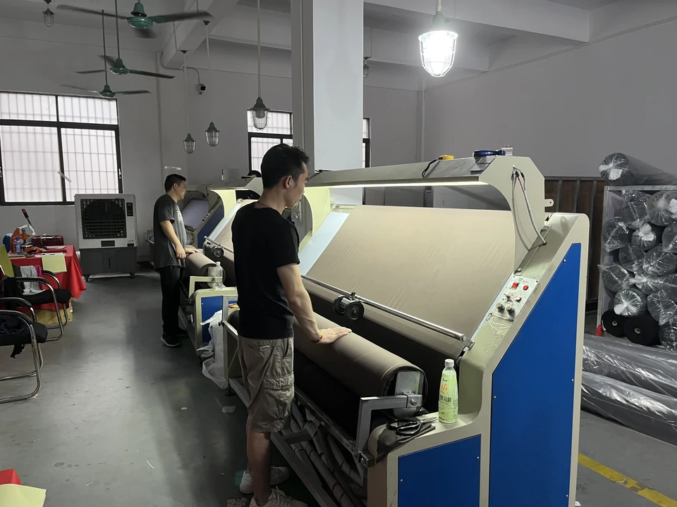 MIQI team inspecting fabric before activewear production