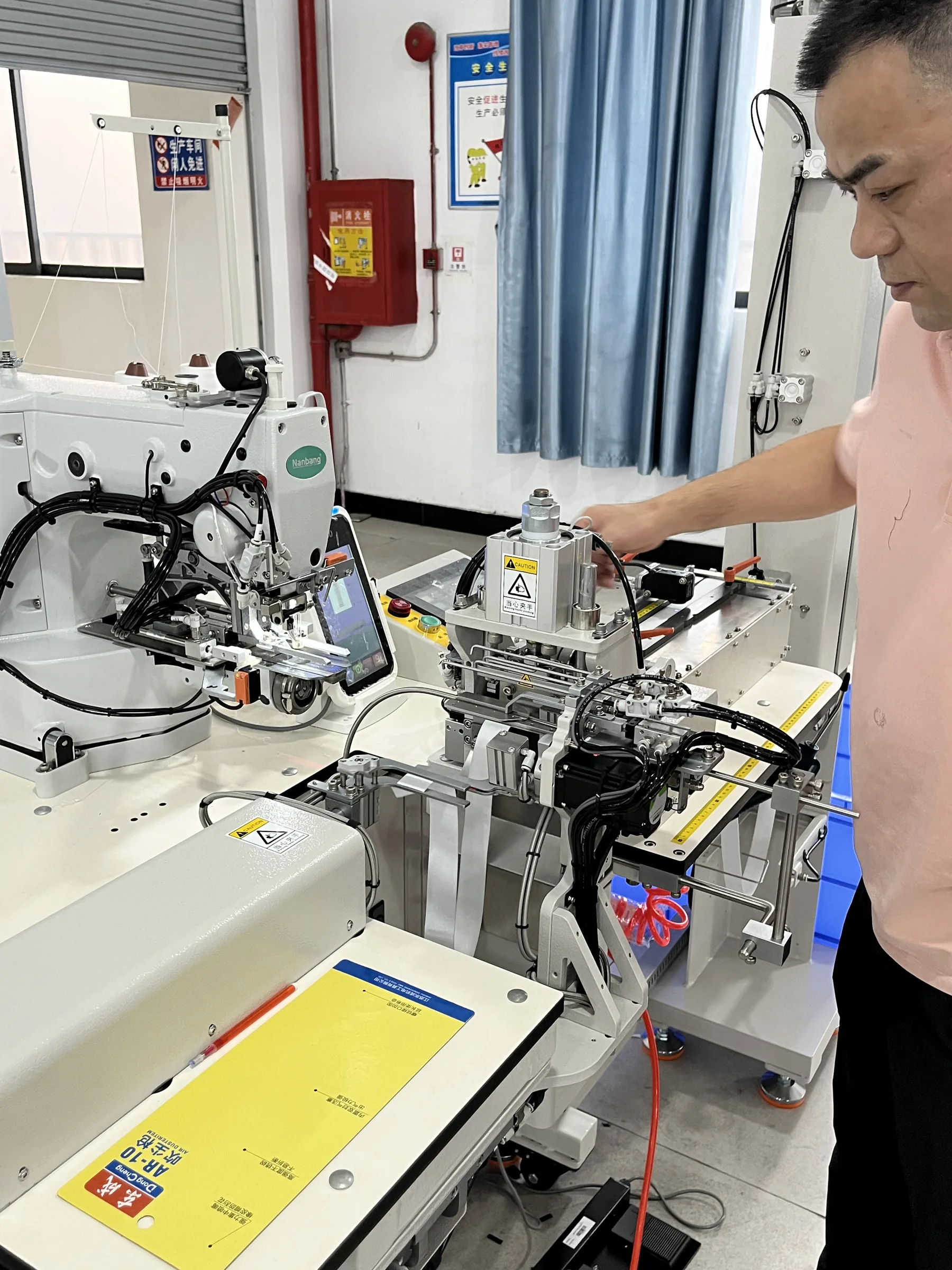MIQI technician operating an automatic elastic application machine