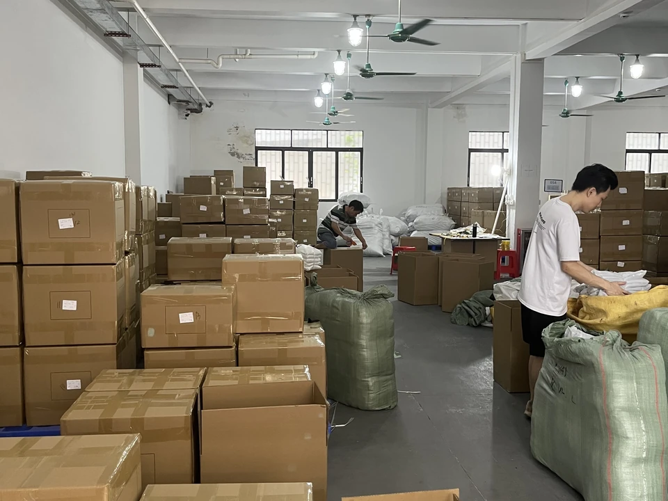 Packed activewear organized into shipping cartons